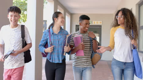diverse group of teenagers walking in a high school corridor