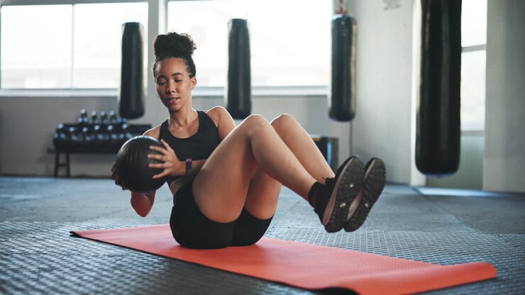Fitness, gym and woman with medicine ball