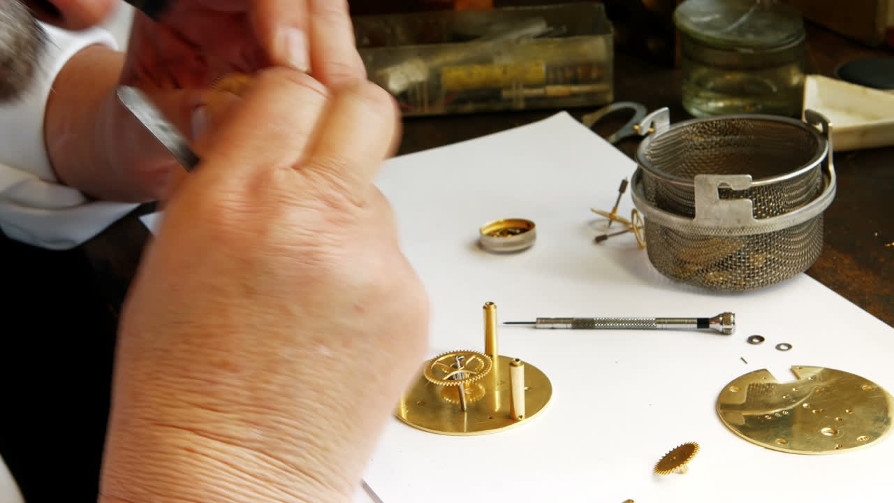 Horologist repairing a watch