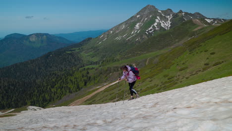 woman hiking in snowy mountains