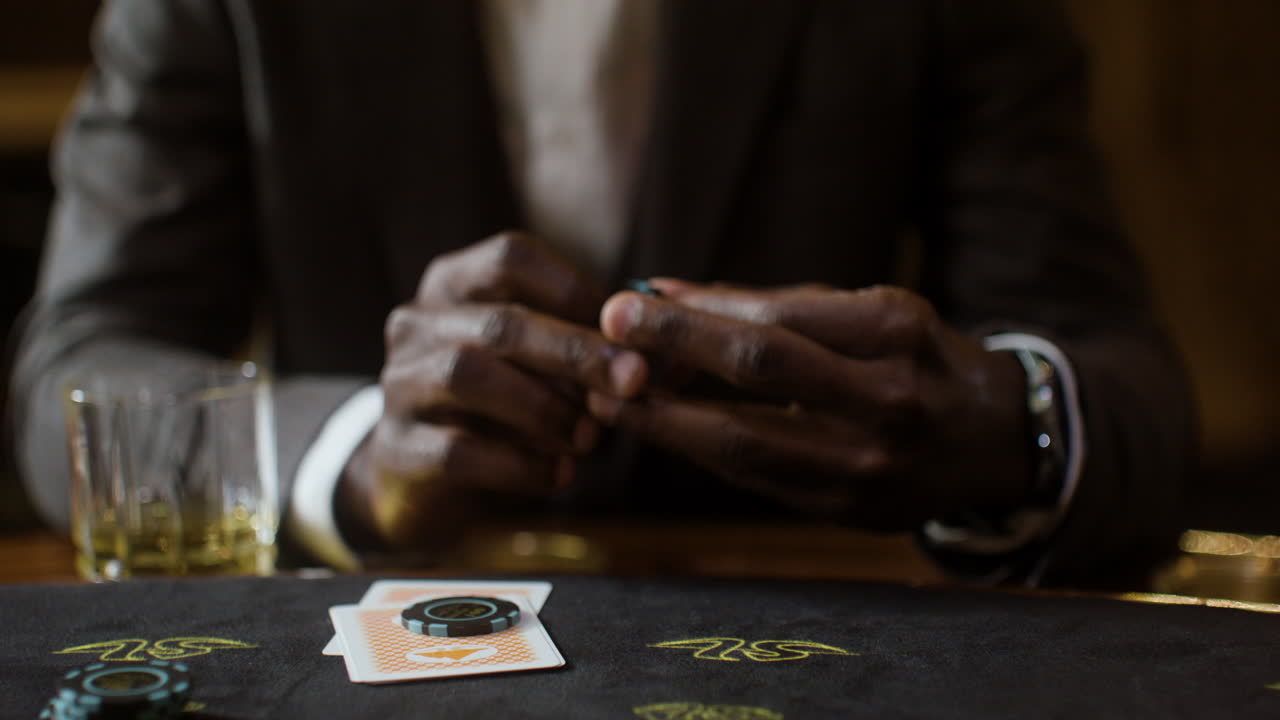 Man playing poker in the casino.