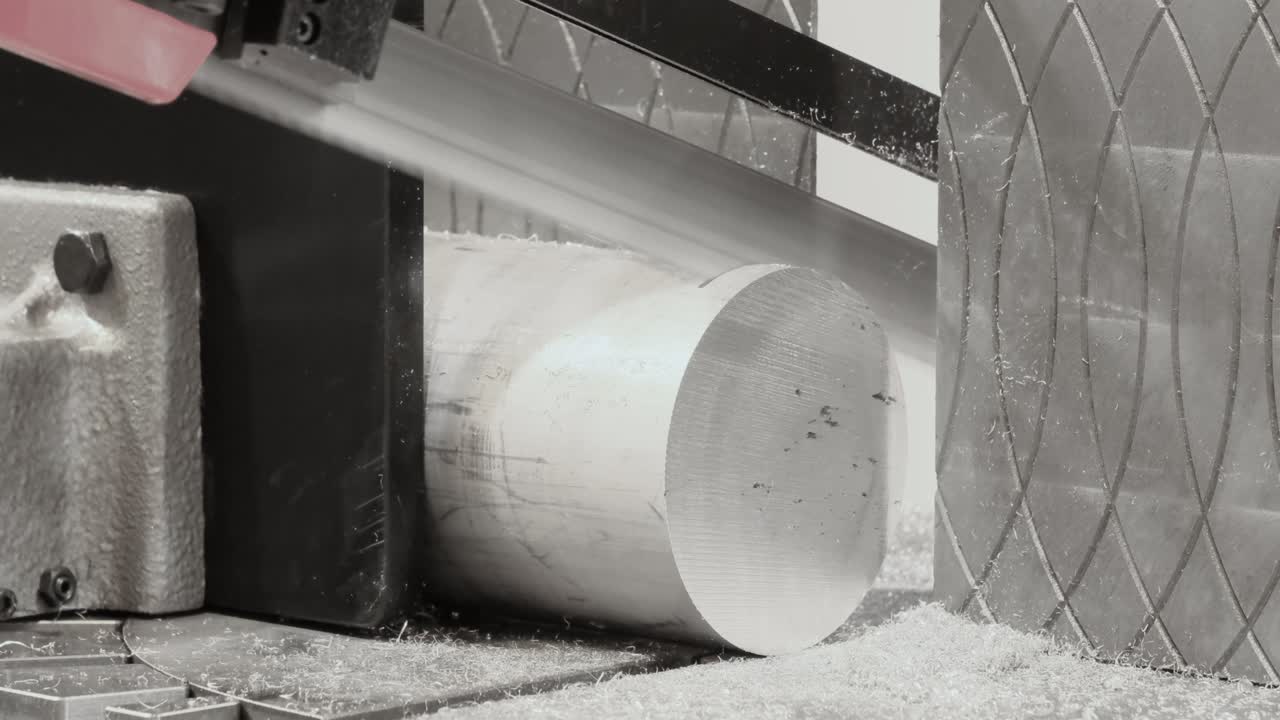 Automatic saw bandsaw sawing metal workpiece, industrial concept background