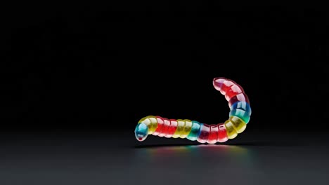 colorful jelly worm on black background