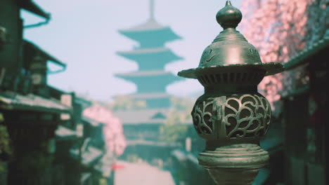 japanese lantern in a traditional street with a pagoda in the background