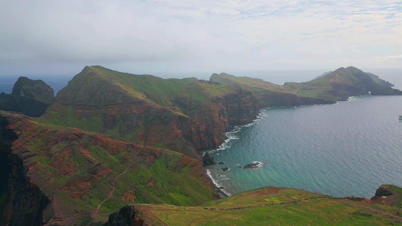 Breathtaking seaside cliffs panorama on cloudy morning. Tranquil sea water wash