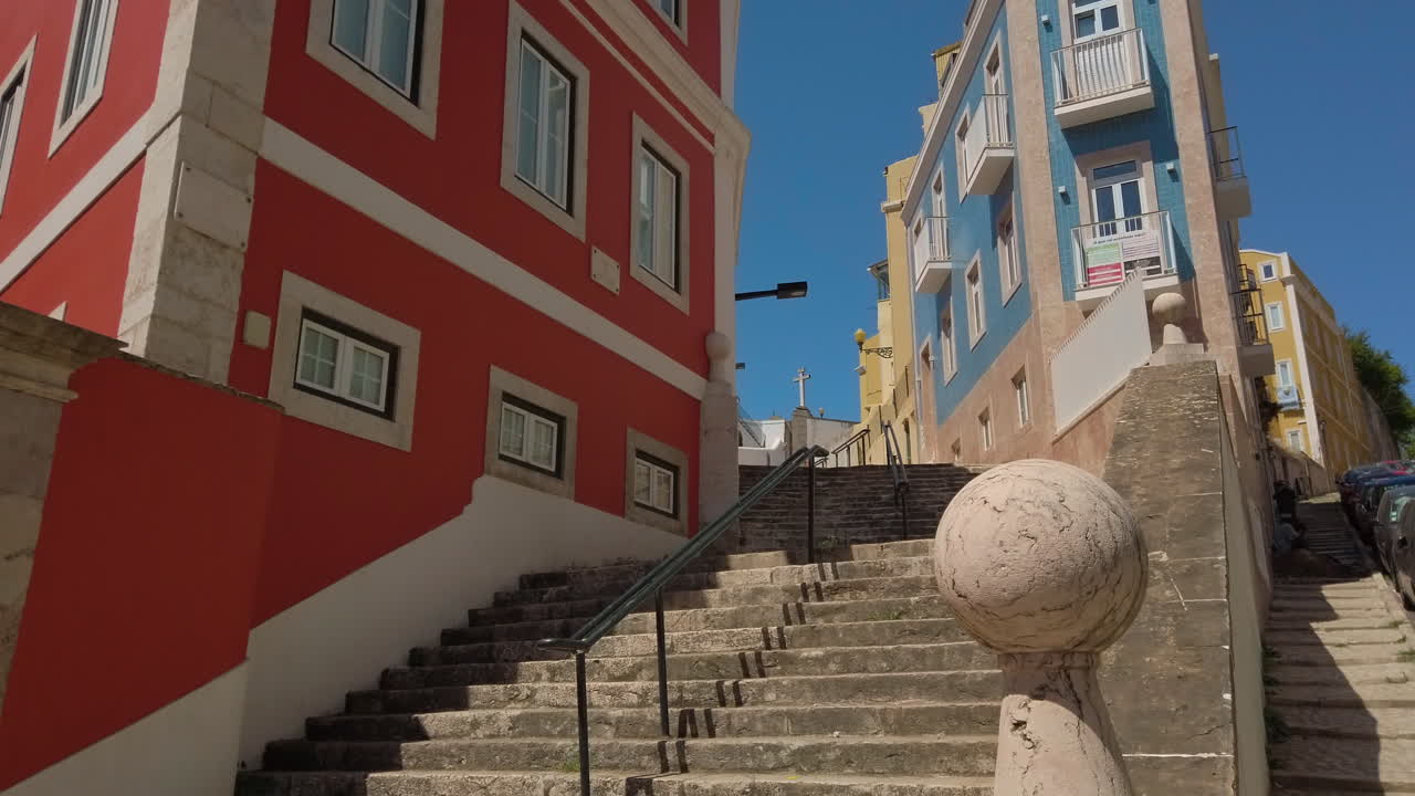 Vibrant stairs in Lisbon, showcasing colorful tiles and urban charm in a sunny setting
