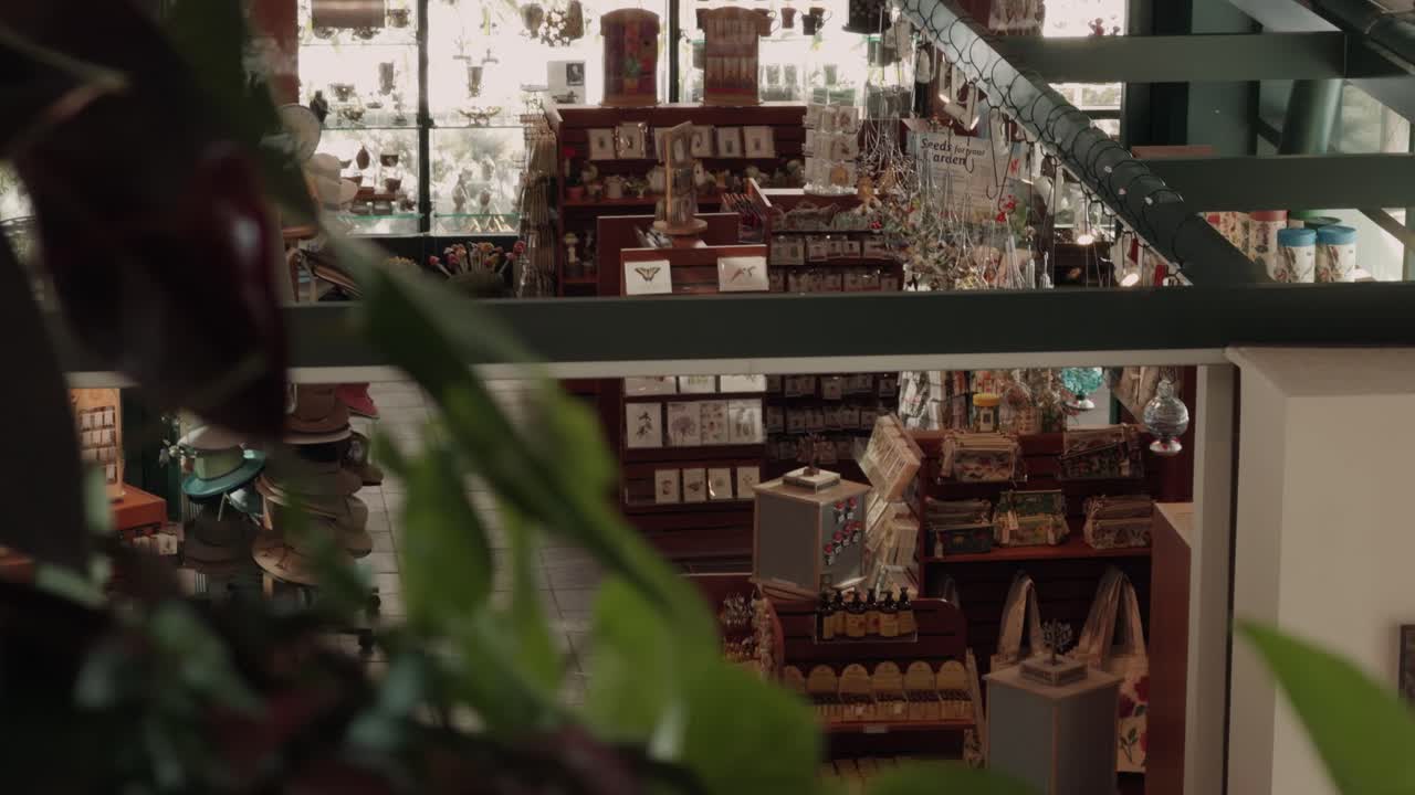 Steady glide pan revealing cozy gift shop from above