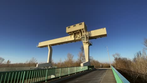 Crane-industrial-on-hydro-plant-sunny-wide,-Mosonmagyarovar,-Hungary