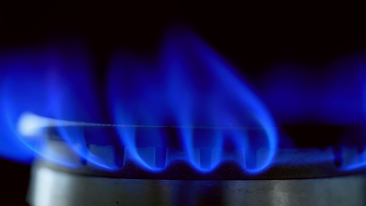 Gas Stove Burner Blue Flame. Kitchen gas cooker with burning fire propane gas