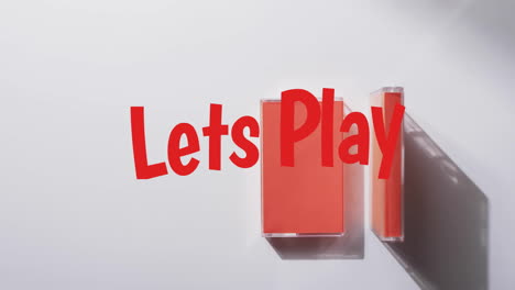 animation of let's play text over tape on white background