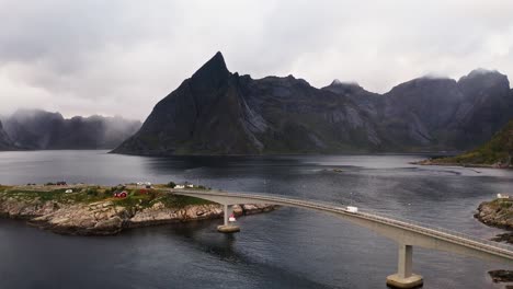 aerial view of a white campervan crossing the hamnøy bridge near reine, lofoten islands, norway