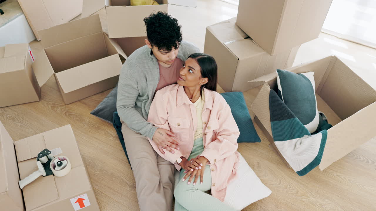Happy couple, real estate and relax with boxes