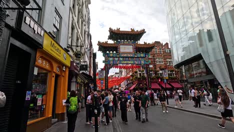 people walking in chinatown, london, august 2024