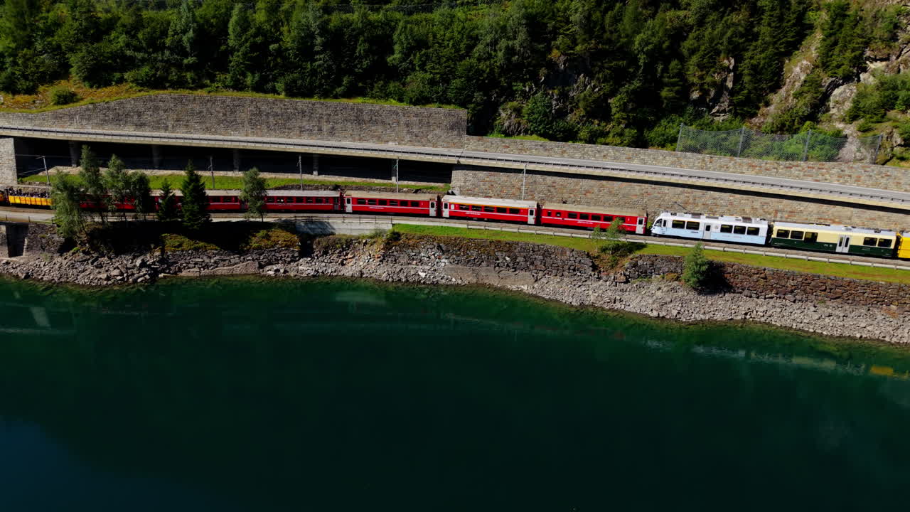 Trains by a serene lake with lush forest, scenic and peaceful vibe