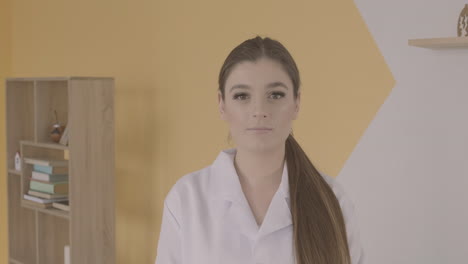 Redhead-Doctor-Woman-In-White-Coat-Looking-Serious-At-Camera