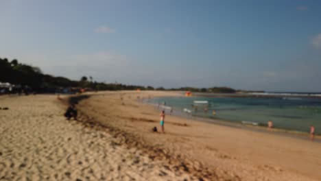 Slow motion footage on Bali Indonesia beach Nusa Dua filming young white man smiling.