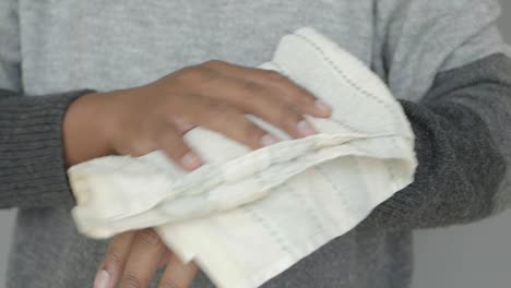 man drying his hands with a towel