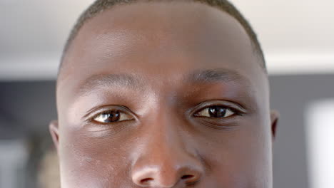 close-up of a young african american man's face indoors