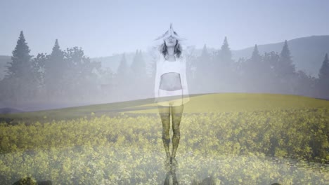 animation of glowing light over woman practicing yoga over meadow and forest