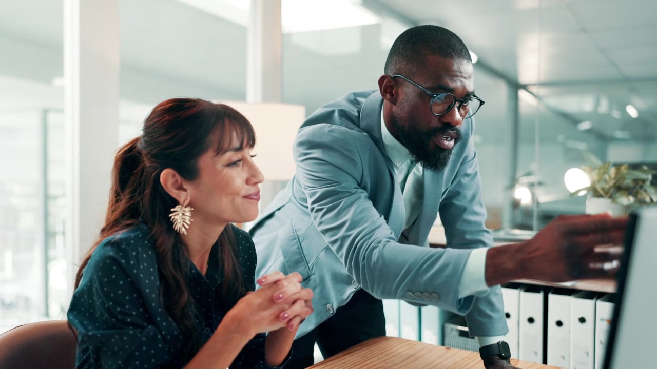 Professional Colleagues Collaborating on a Project in a Modern Office