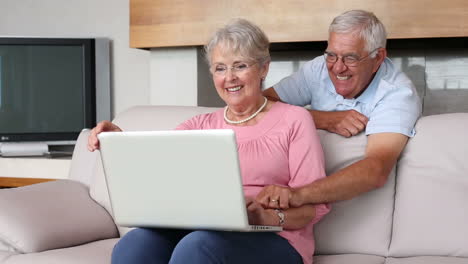 Senior-couple-using-laptop-together