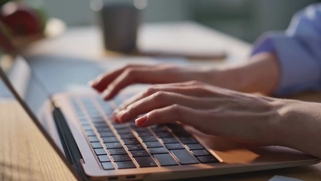 Businesswoman hands typing laptop at office desk closeup. Smiling woman work