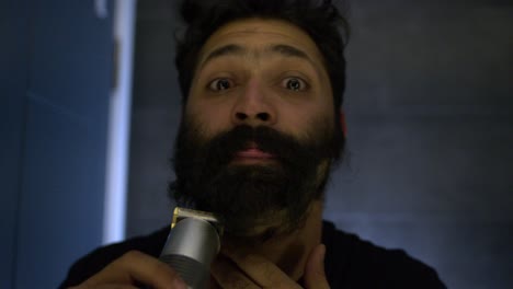 psychopath shaving his thick beard with different emotions