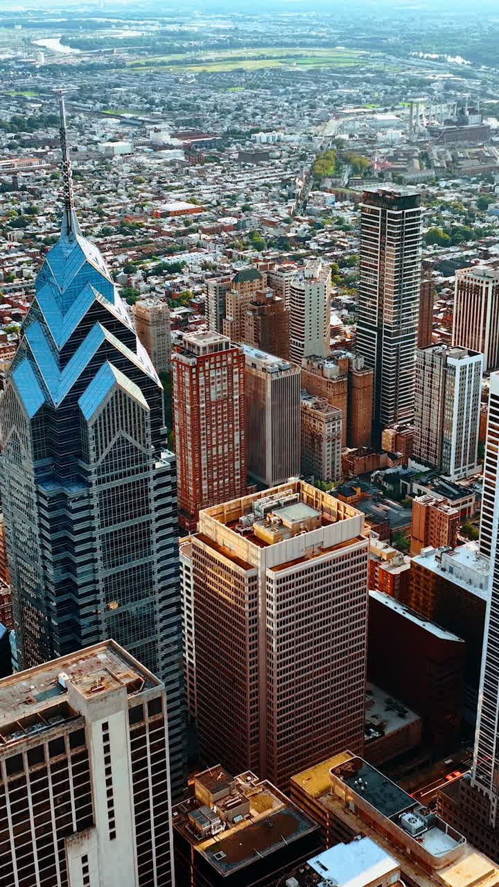 Remarkable view of Philadelphia downtown panorama. Drone footage distancing from the tops of gorgeous skyscrapers. Vertical video