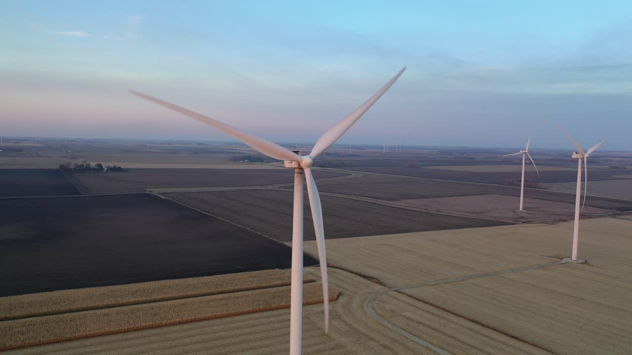Wind Farm Over Agricultural Fields at Sunrise/Sunset