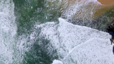 overhead drone view of sea waves