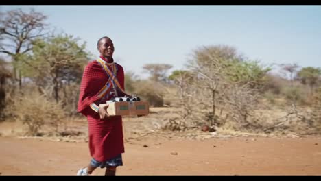 a joyful encounter: a maasai man delivers goods to an elder in the open african landscape, celebrating tradition and community bonds