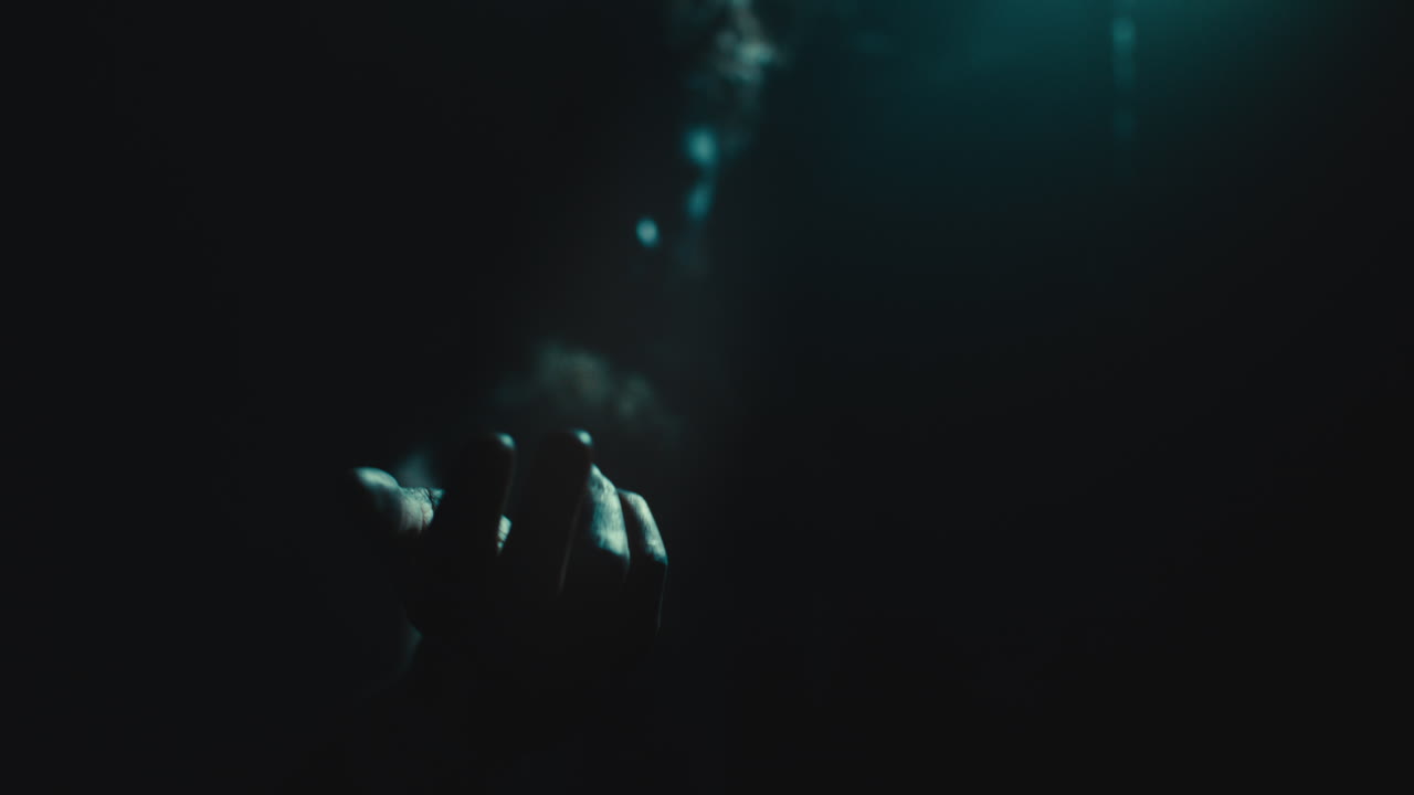 The witch makes a beckoning gesture with her hand