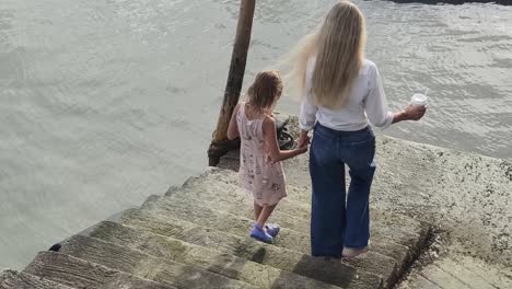 Mother and Daughter on a Pier