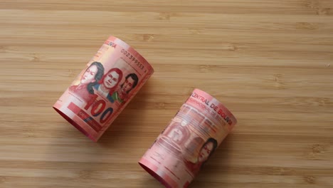 bolivian currency, curled money placed on the table, banknotes of high value