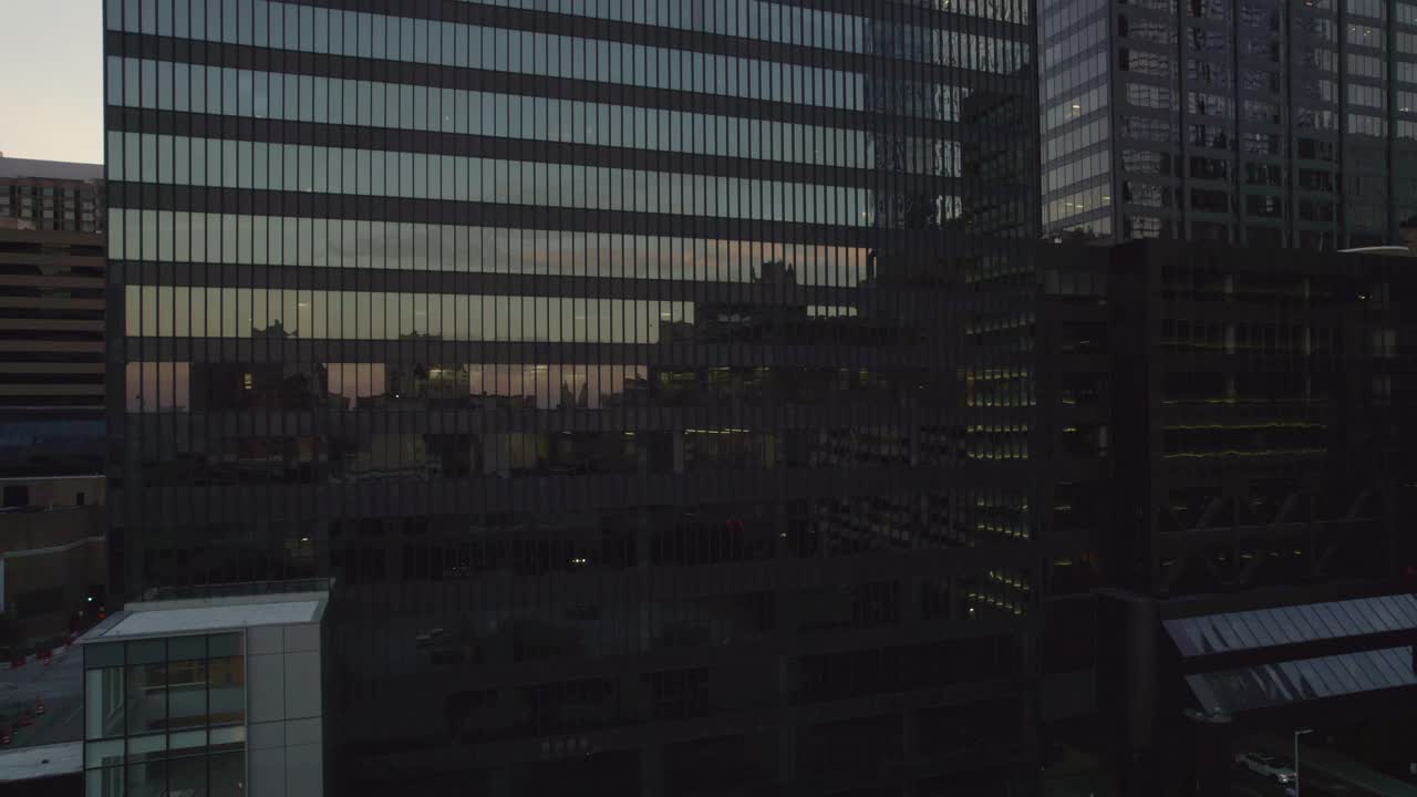 Sky reflections on building in Downtown Houston at dusk