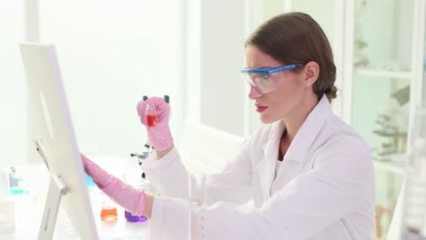 female scientist analyzing samples in a laboratory