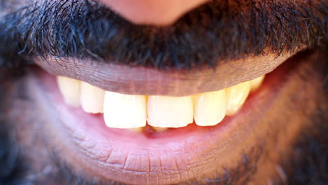 close up of the mouth and teeth of a smiling black man