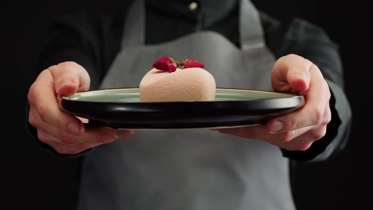 Chef presenting a delicate dessert