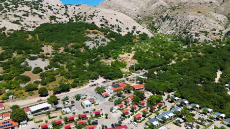 campsite at campig skrila, krk island, stara baska croatia, aerial view of the mountains and coast with boats, beaches and adriatic sea. the seaside rv campmobiles on a summer beautiful coastline