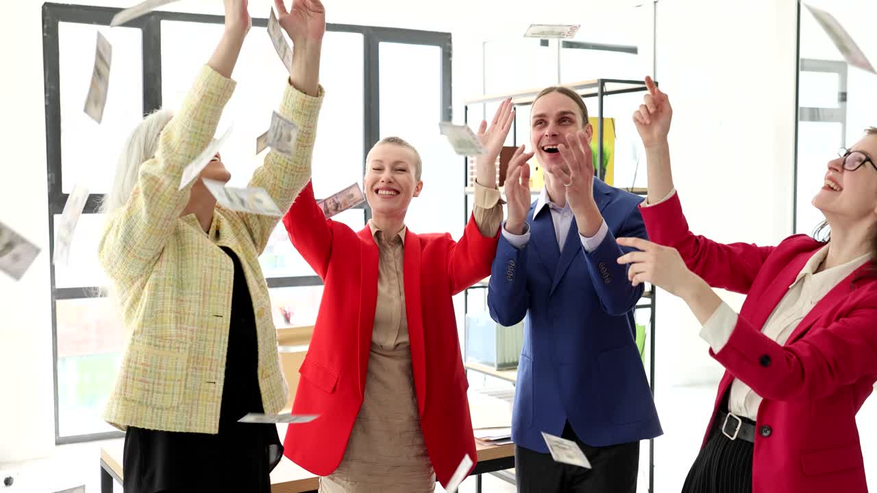 Group of business people celebrating with money falling