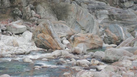 alpine river full of large granite boulders