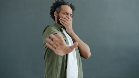 man expressing disgust and disapproval