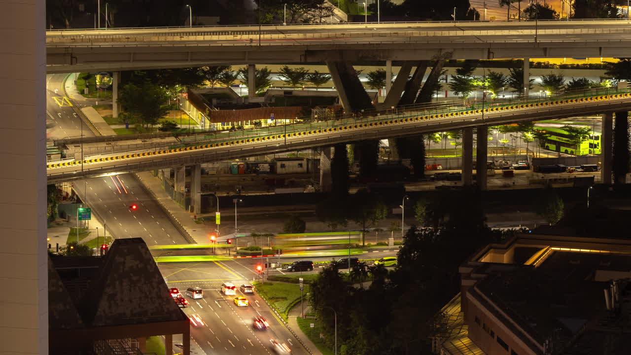 timelapse of the singapore city skyline and traffic on the roads at night