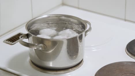 multiple eggs in boiling water