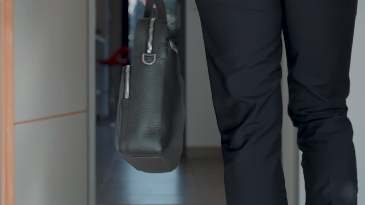 Slow motion shot of a business man walking holding a briefcase for a meeting