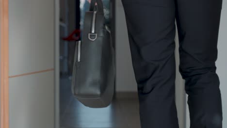 slow motion shot of a business man walking holding a briefcase for a meeting