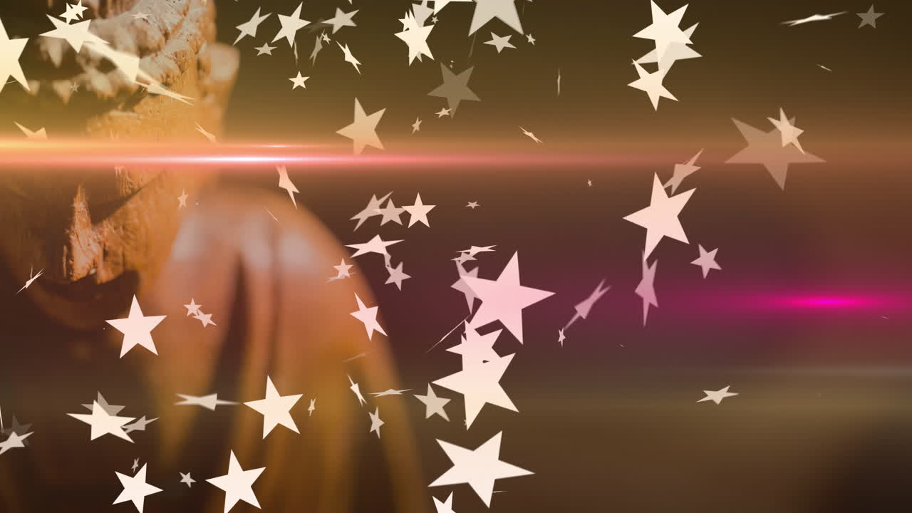Floating star shapes over warm background with partially visible Buddha statue