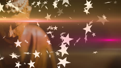 floating star shapes over warm background with partially visible buddha statue