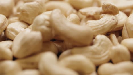 smooth camera movement over a handful of cashew nuts.