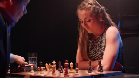 intense chess match: man vs woman